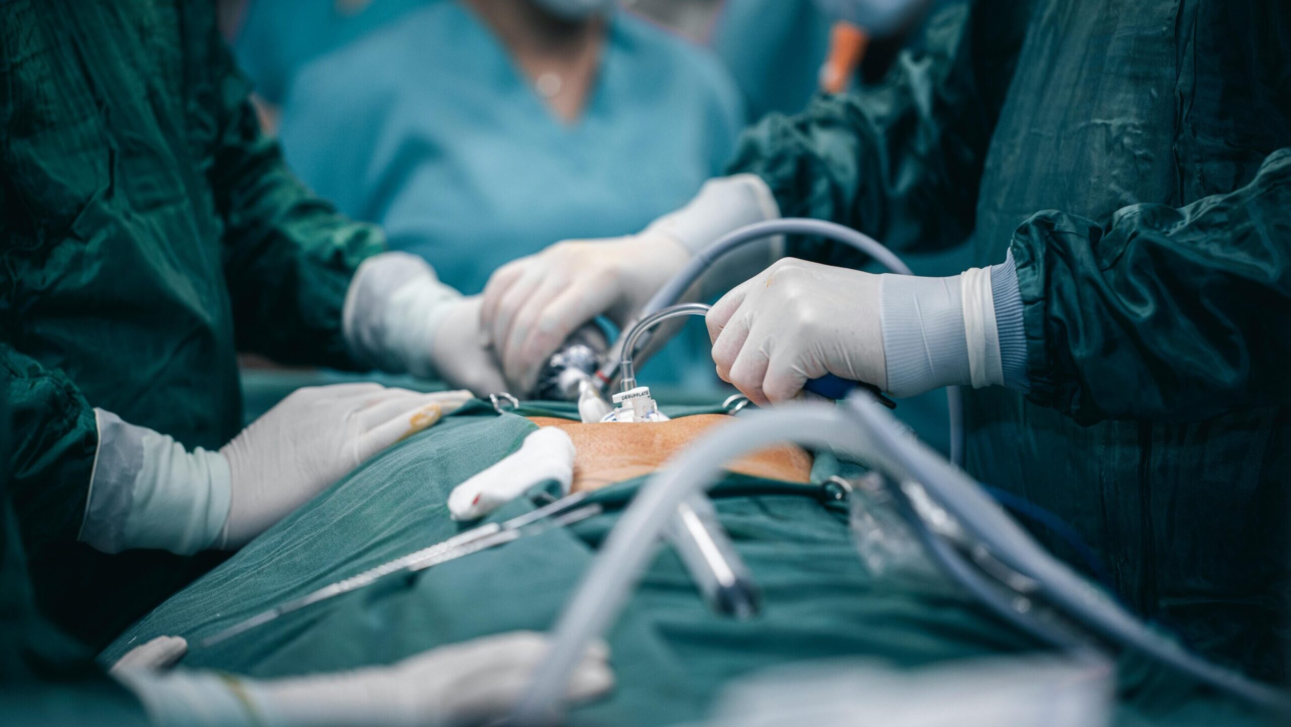 A detailed view of surgeons in action during an operation, highlighting surgical precision.